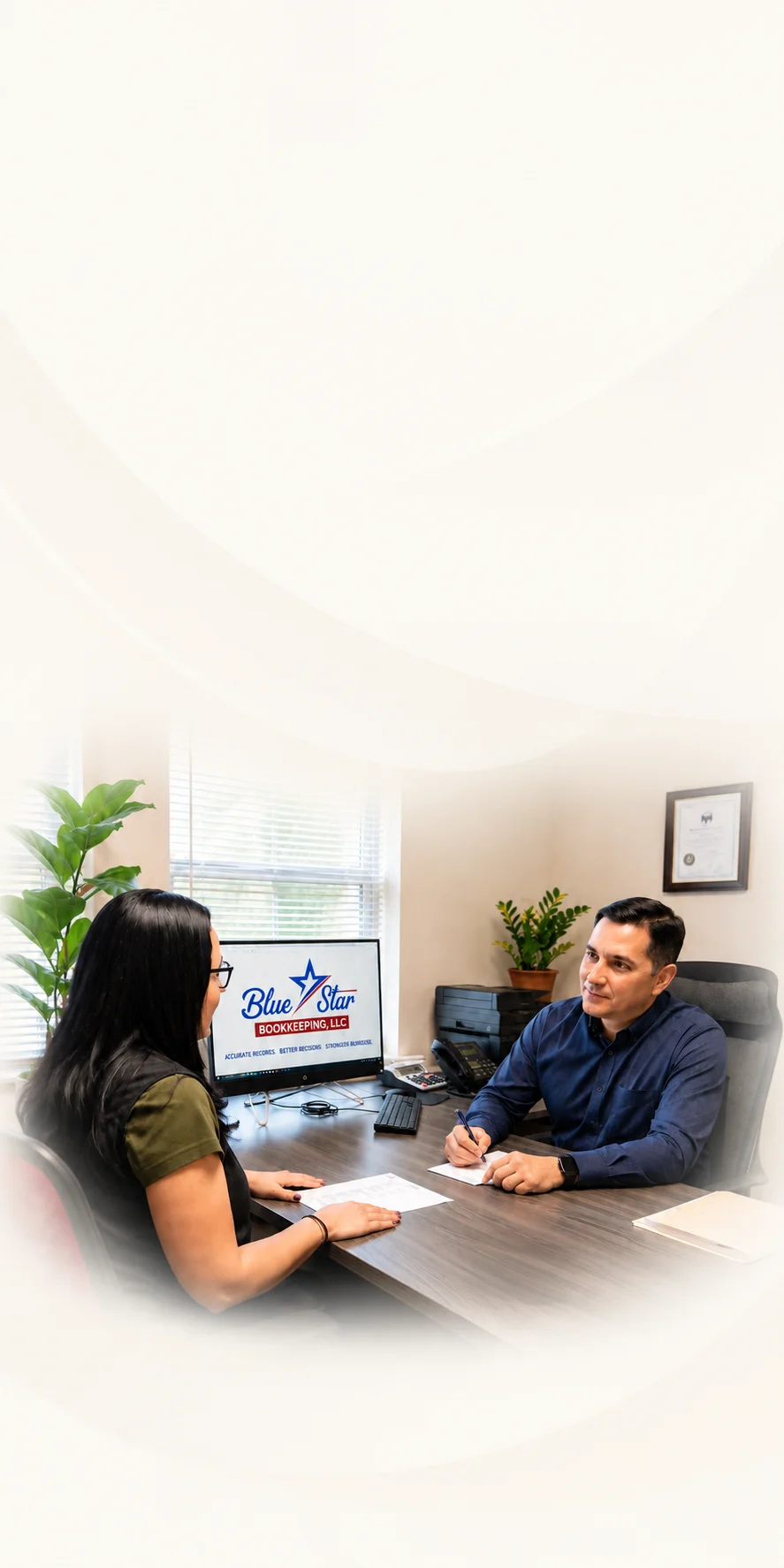Manuel Bonilla helping a client during a consultation at Blue Star Bookkeeping in Austin